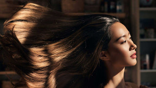 Applying a color-depositing gloss mask to refresh hair color at home