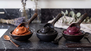 Copper, black, and marsala color-depositing hair masks side by side